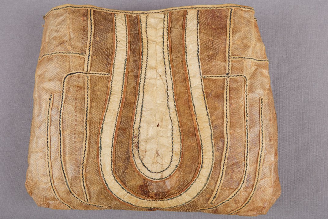 Brown pouch with curved lines