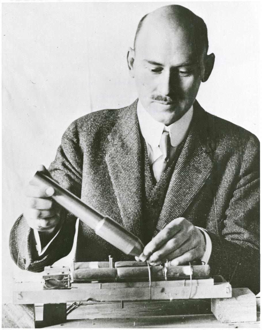 Black and white close up photo of Robert Goddard