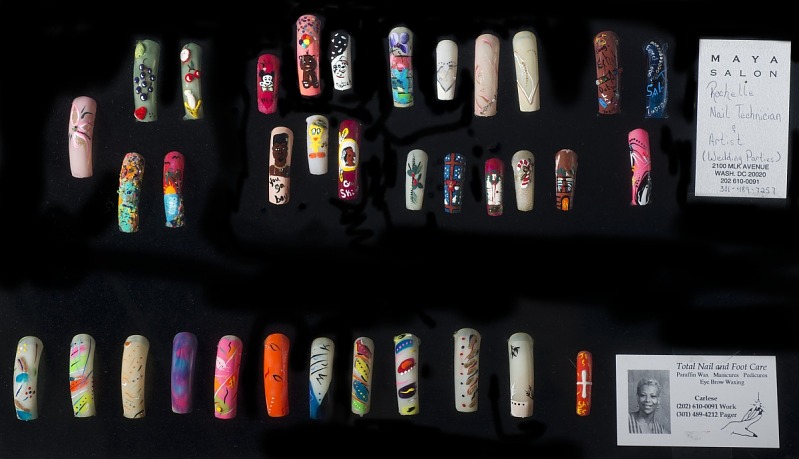 A display case showing art on nails.