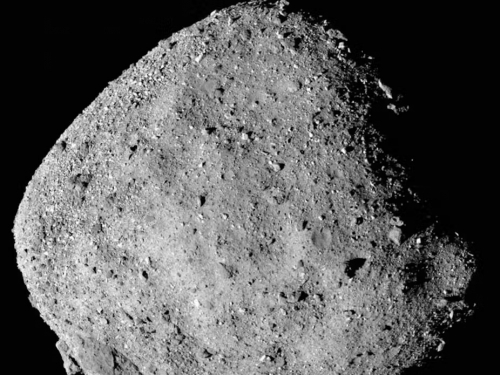 A photo of an asteroid with a rocky, dusty surface.