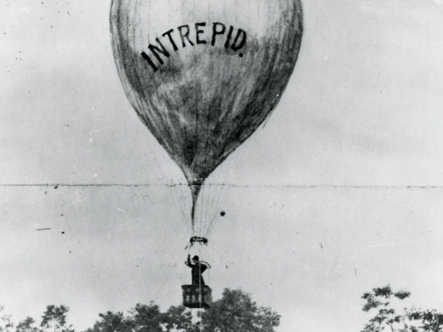 Black and white photo of a balloon ascending