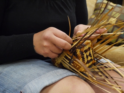 Close up of hands of basket weaver