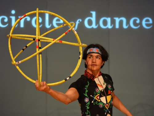 Dancer with yellow hoops