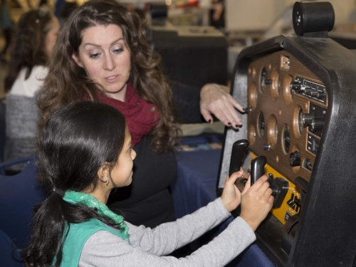 female student using flight simulator