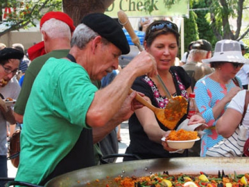 Man serving traditional Basque food at Jaialdi