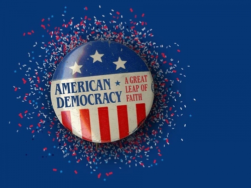 Flag pin that says "American Democracy."