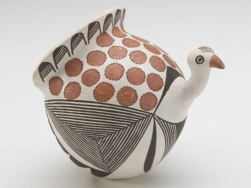 Turkey figurine made of coiled and painted pottery.