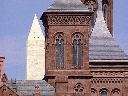 Castle towers with monument in the background