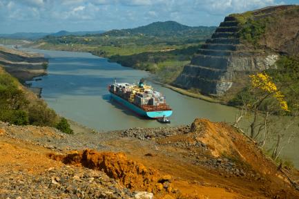 cargo ship traversing Panama Canal